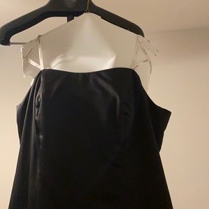 Full length strapless black gown.